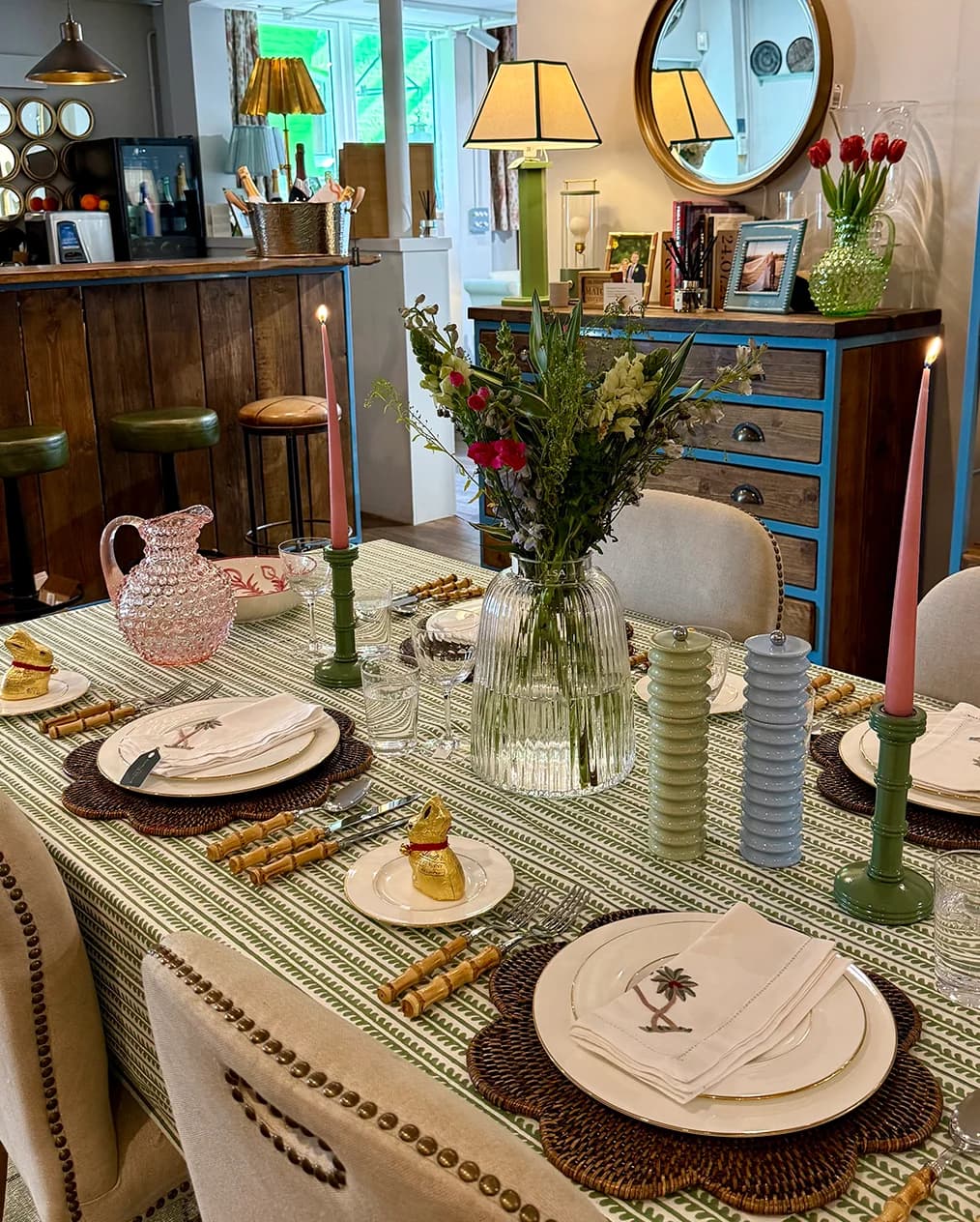 A spring formal setting in The Wedding Present Company showroom, featuring Birdie Fortescue printed tablecloth, The Vintage List glassware, and tableware from OW London and Rebecca Udall