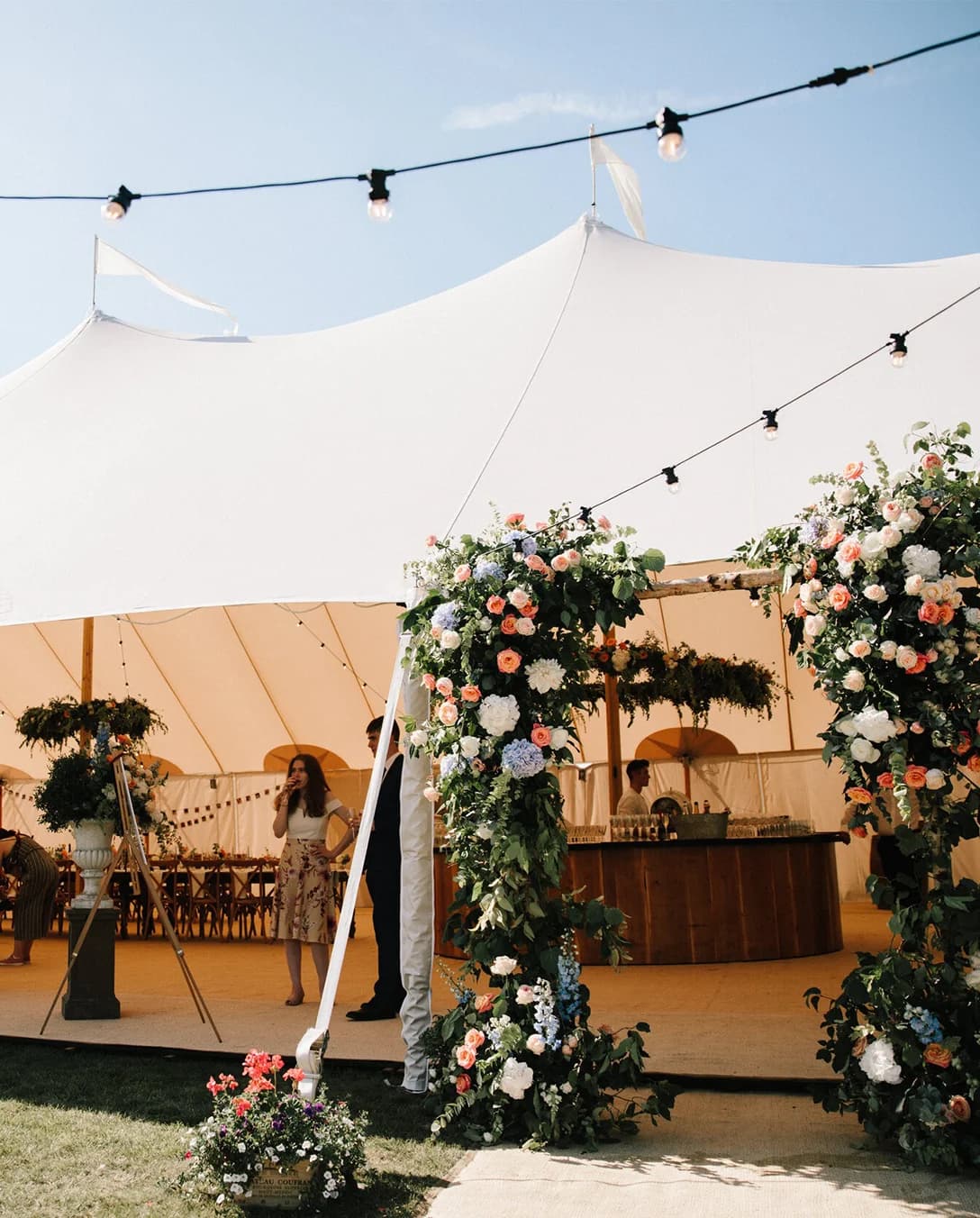Wedding marquee with a floral arch