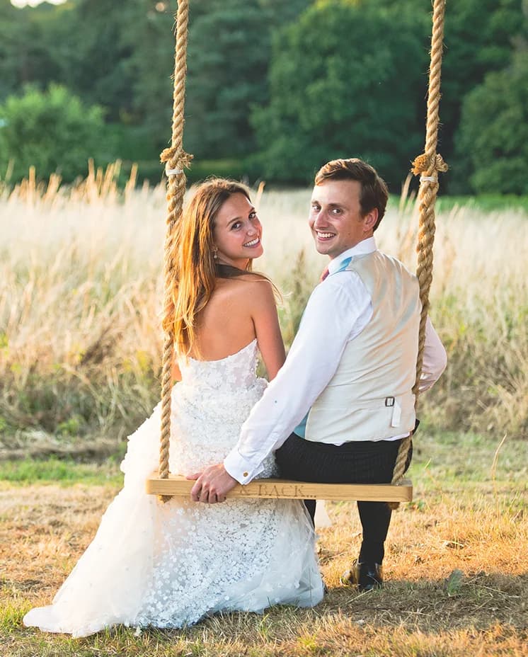 Bride and groom on a swing