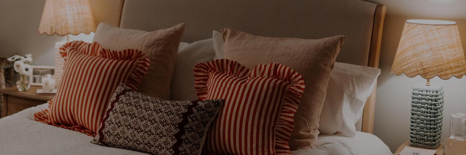 Stripped cushions on bed
