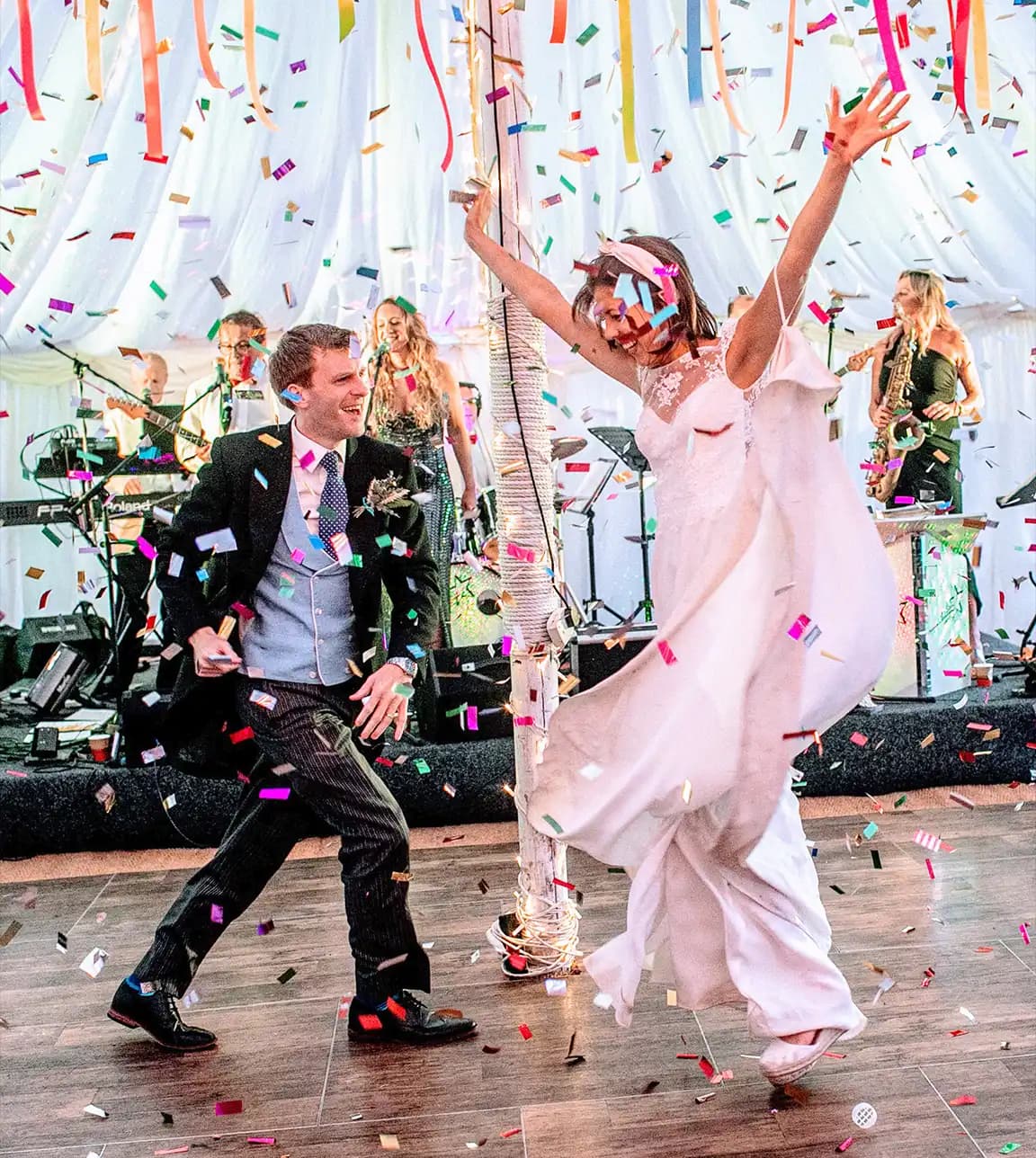 Bride and groom do a creative first dance with confetti