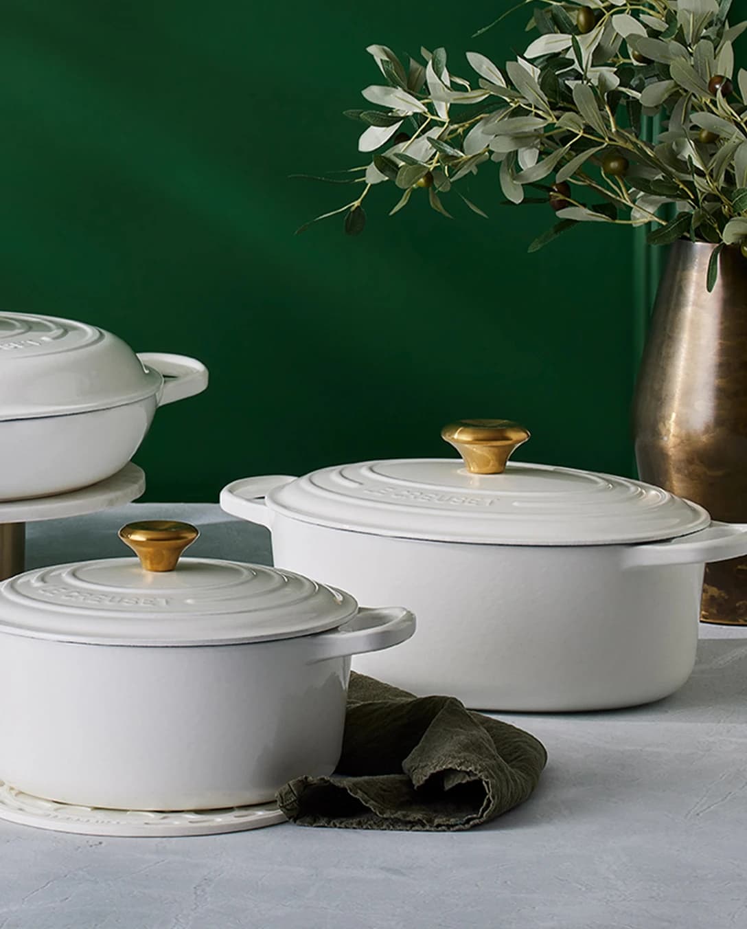 A mix of Le Creuset casseroles in Rhone colourway