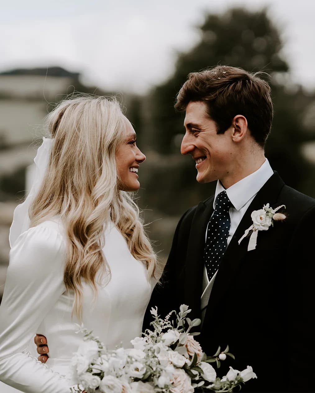 Bride and groom with the flower bouquet in their Salcombe wedding