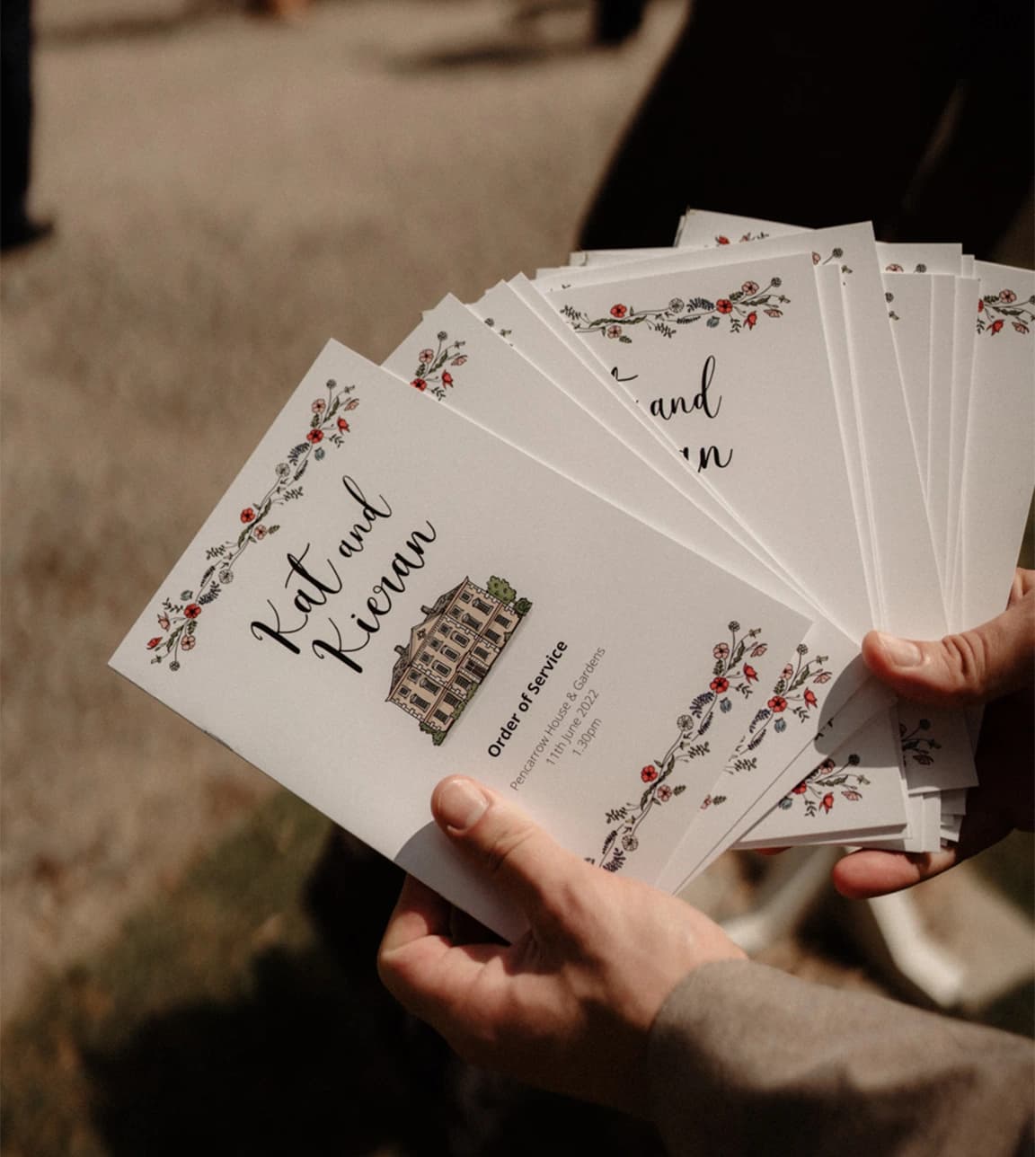 Custom illustrations by Ella's Books for the wedding order of service featuring calligraphy and watercolours