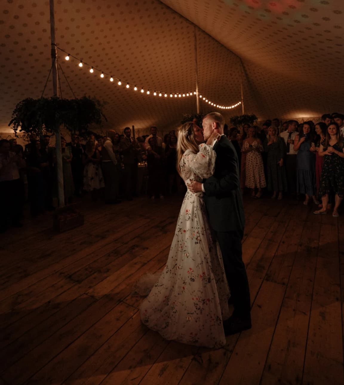 Bride and groom enjoy their first dance at their marquee wedding