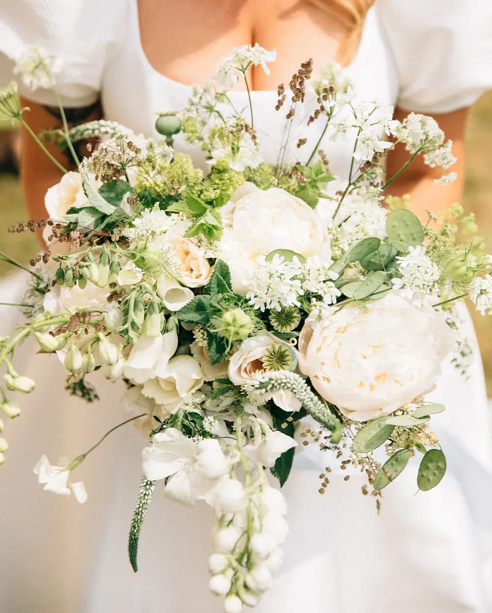 white whimsical wedding bouquet featuring peonies