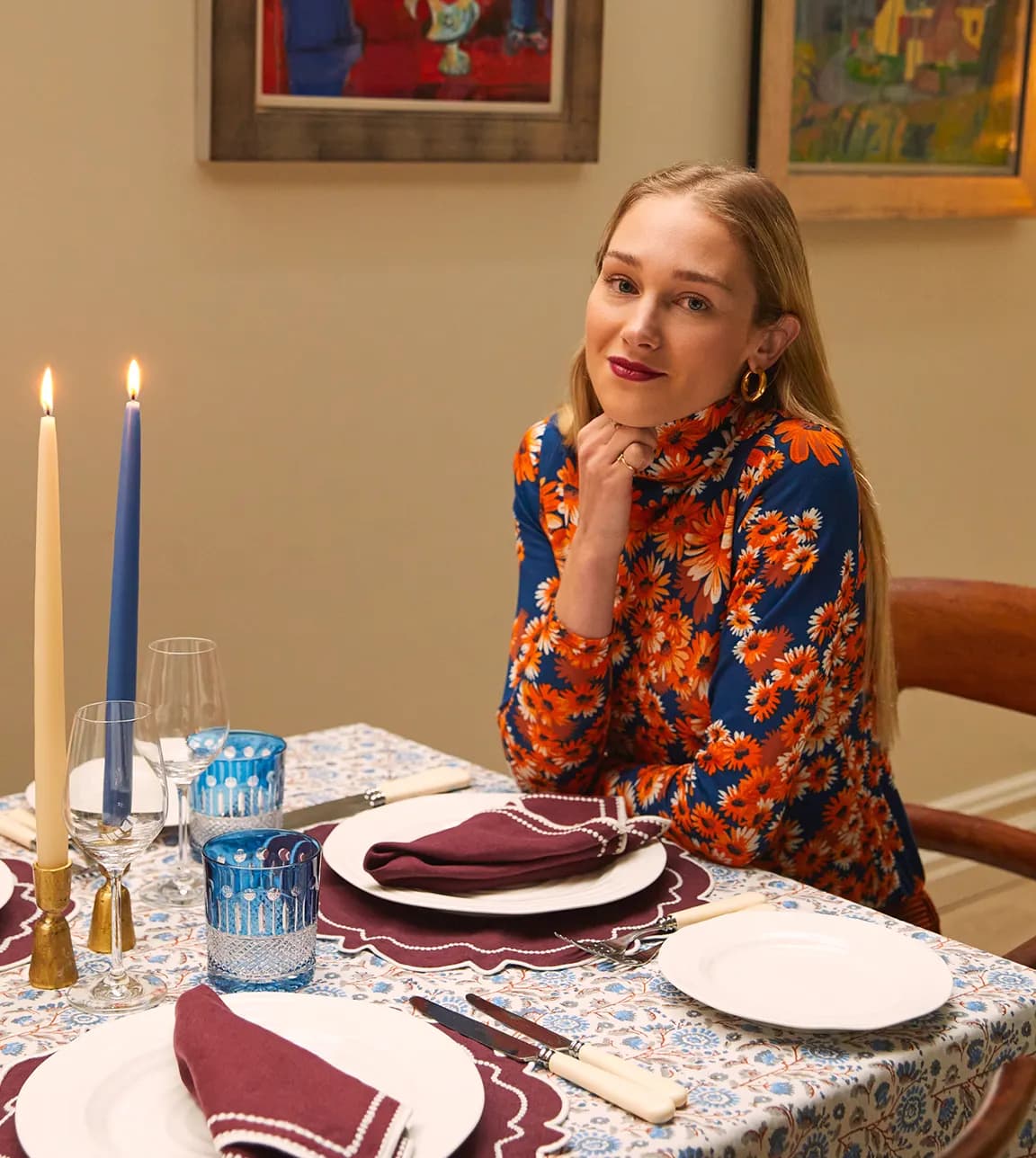 Rosalyn Wikeley sits behind the table with a cosy tablescape featuring wedding gifts form The Wedding Present Company