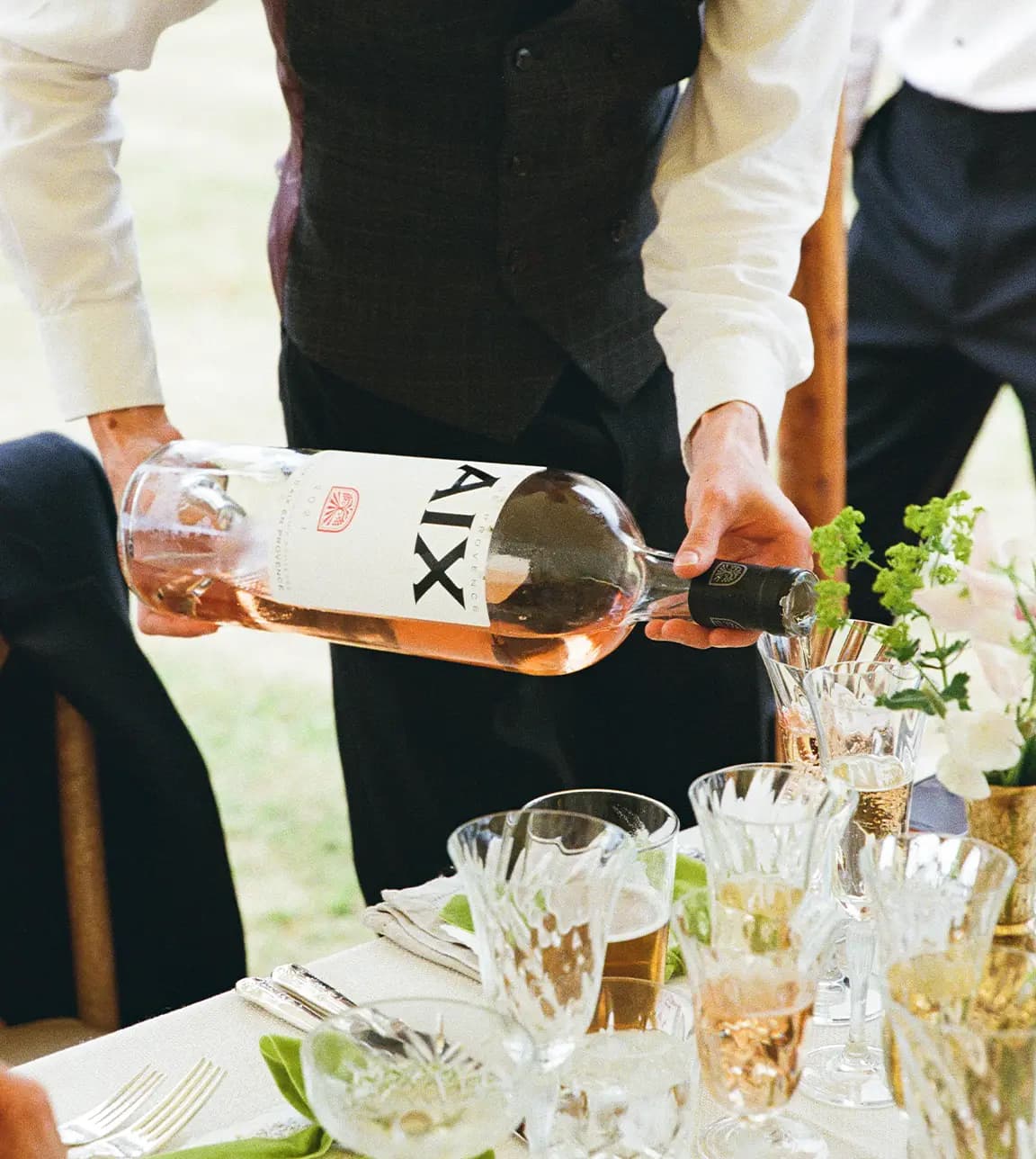 Wedding wine is being served from magnum bottle during Tuscan-inspired wedding.