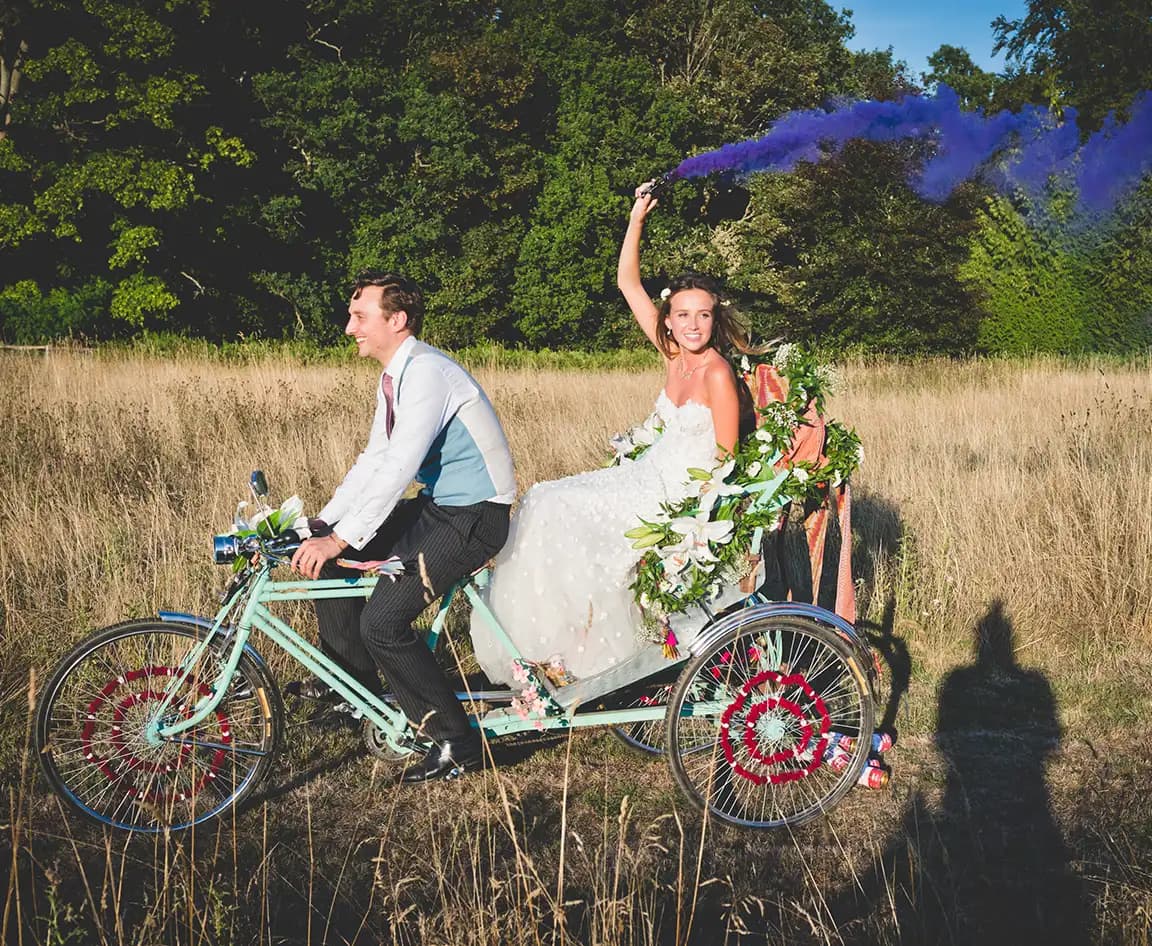 Wife and husband on a biking on a rickshaw to their wedding reception
