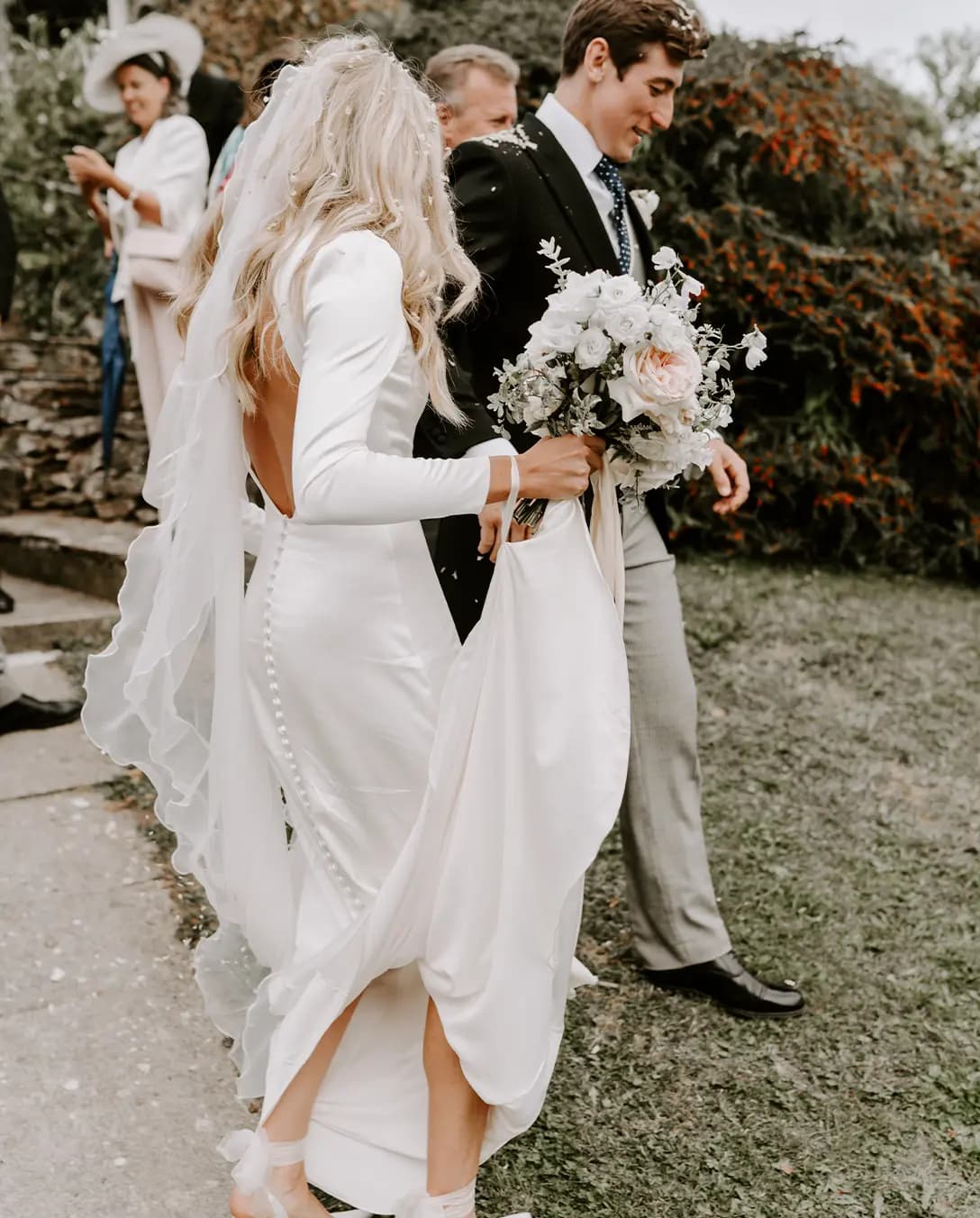 bride outfit details groom suit and tie