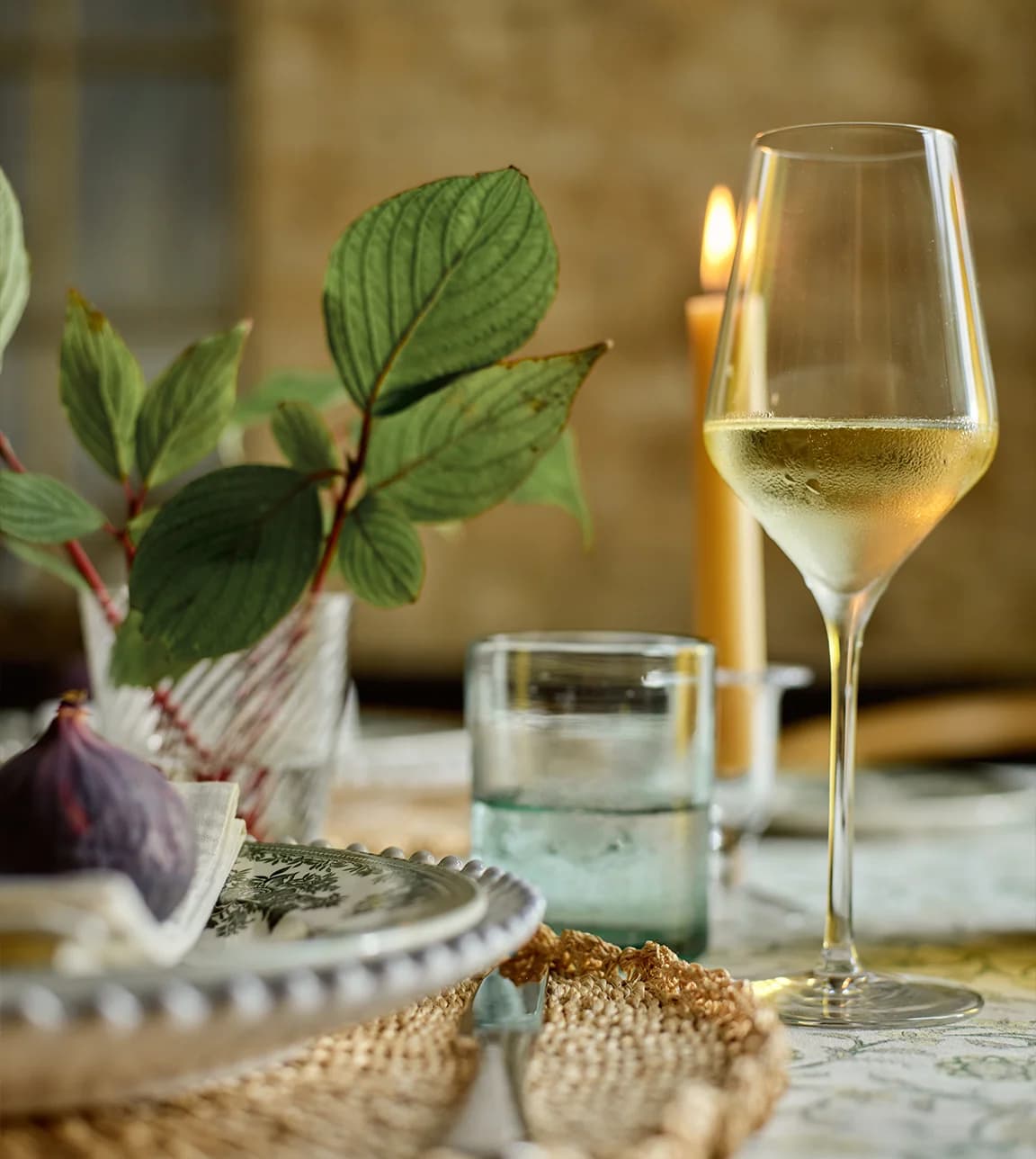 Elegant green table setting featuring the perfect white wine glass for your wedding registry.
