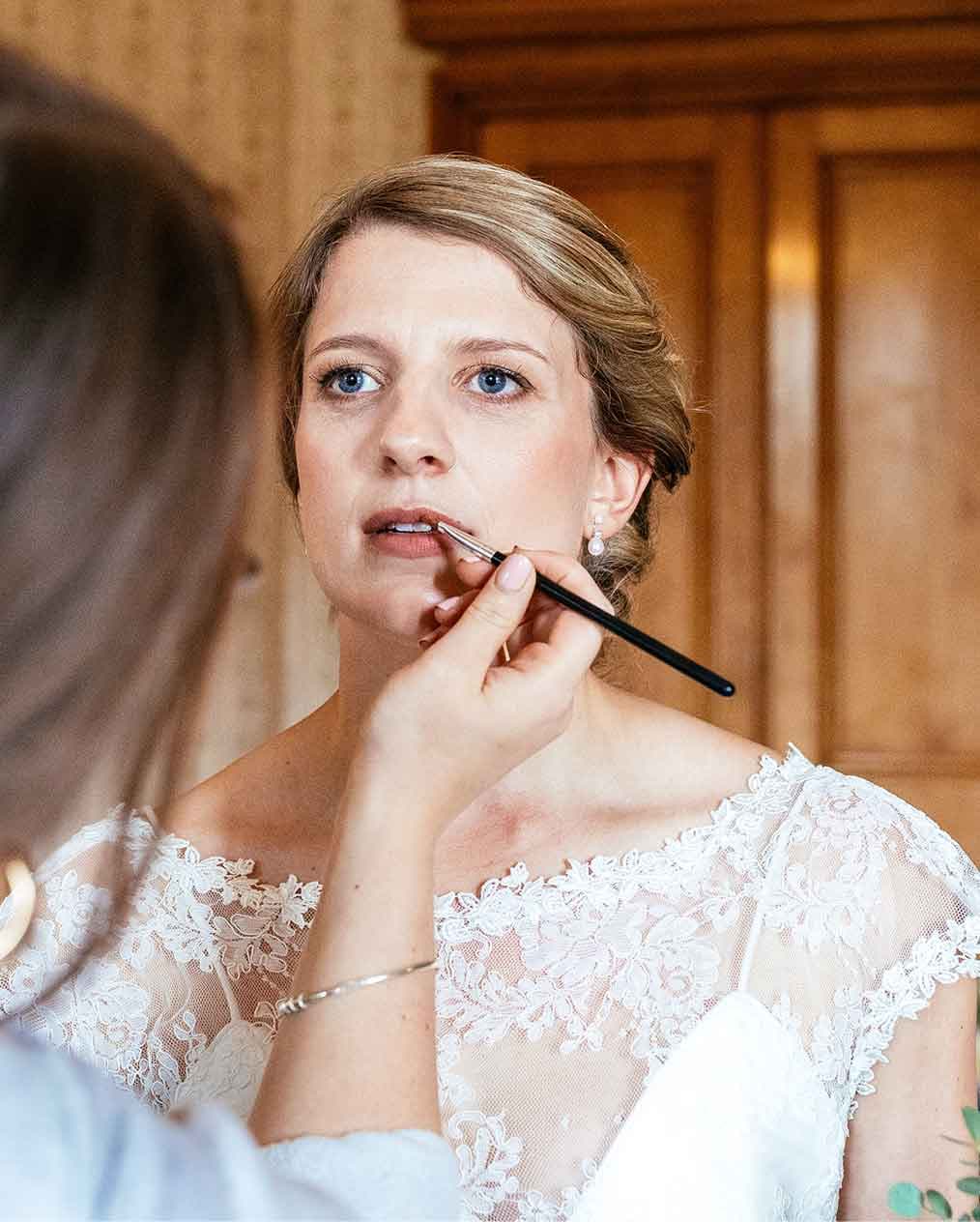 Bridal make-up being done by artist on bride