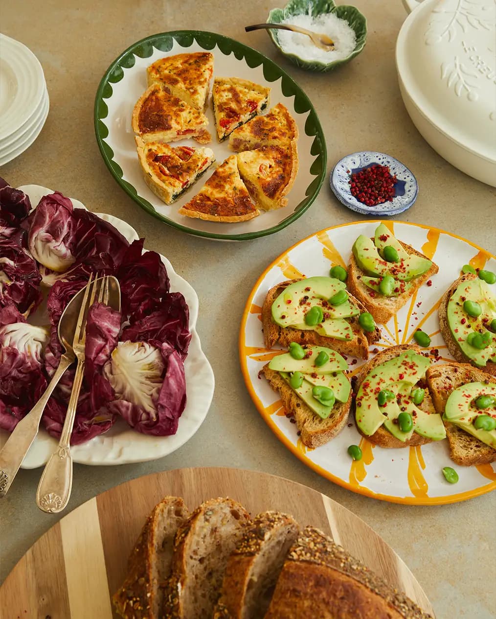 Ottolenghi-style food served using wedding gifts, handpainted tableware and serveware