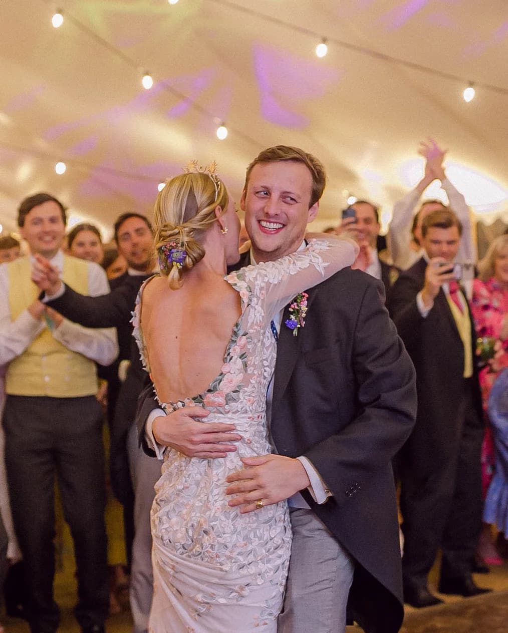 bride and groom wedding party hugging