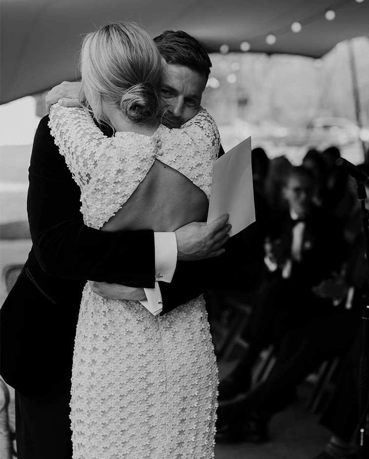bride and groom hugging after wedding vows