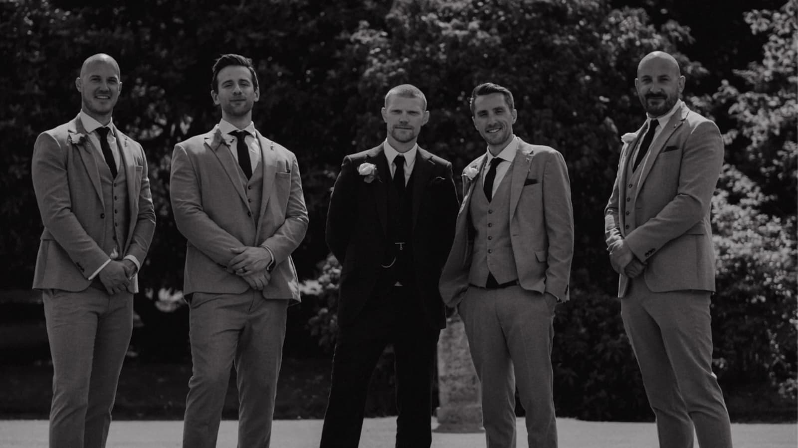 Groom wearing a bespoke Tailor Made suit with his groomsmen