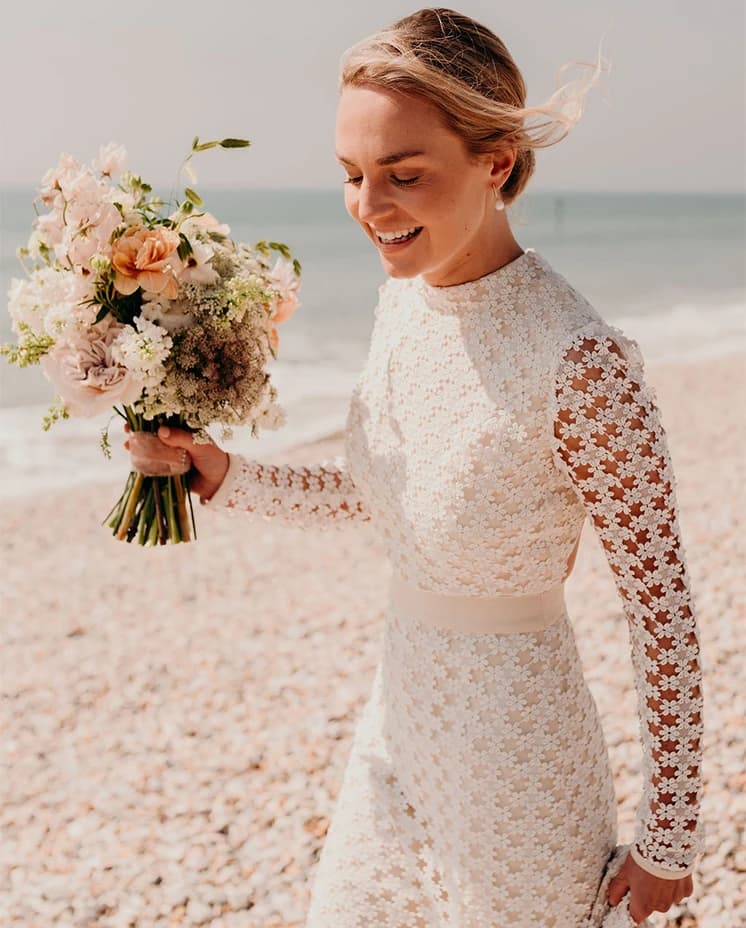 bride fashion wedding dress beach flowers