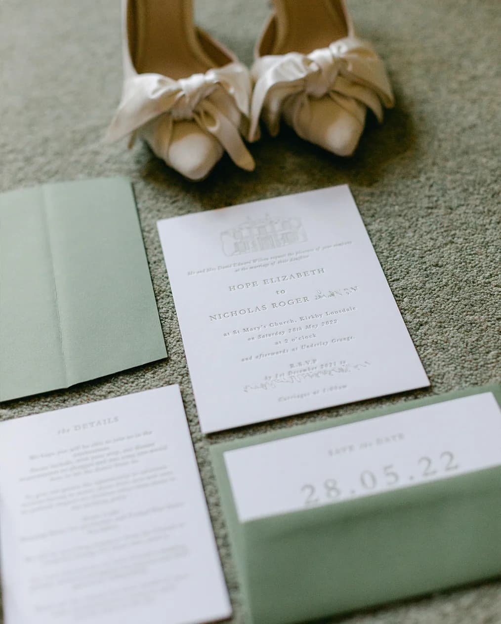 An assortment of elegant embossed wedding invites and save the dates.