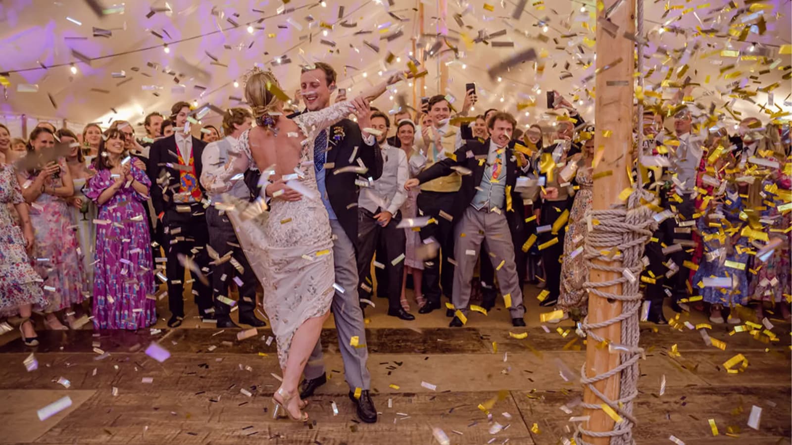 bride and groom having fun dancing at wedding party