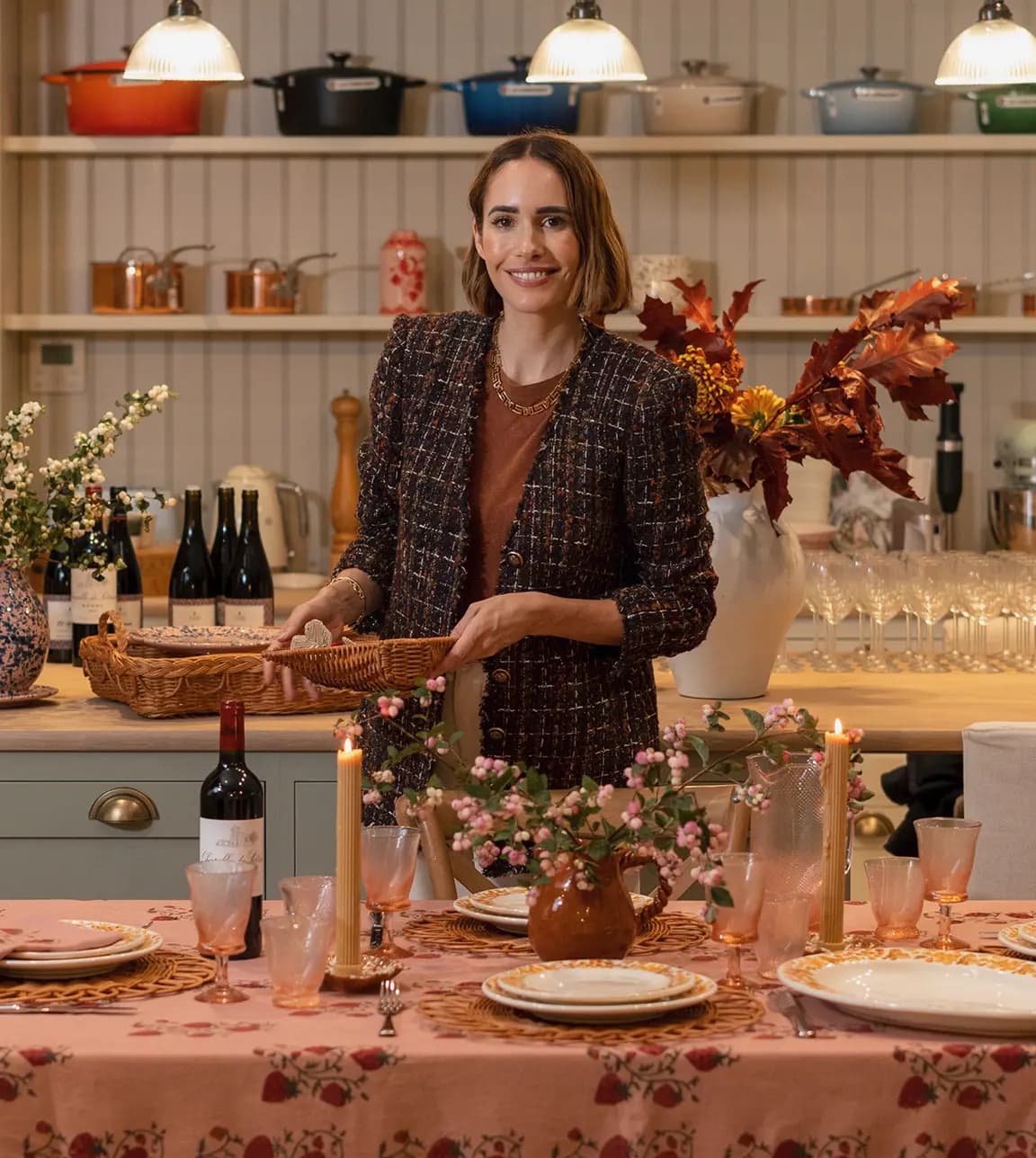 Louise Roe, the founder of Sharland England, stands in The Wedding Present Company in front of Autumn-inspired tablescape, sharing her hosting tips
