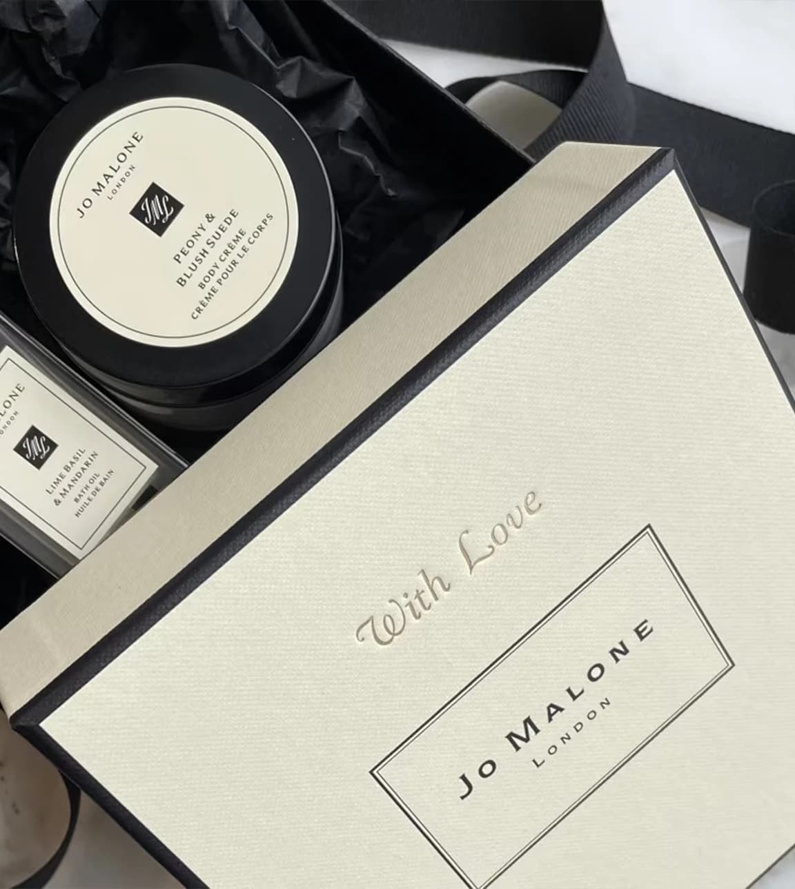 Jo Malone pampering set packed as a wedding favour in a box with embossed 'With Love'