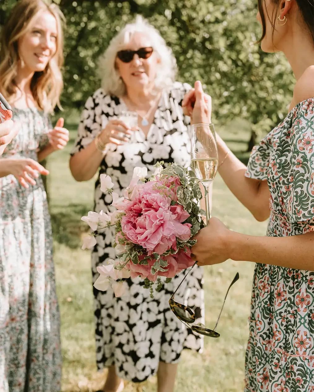 Wedding guests and bridesmaids enjoy wedding drink reception