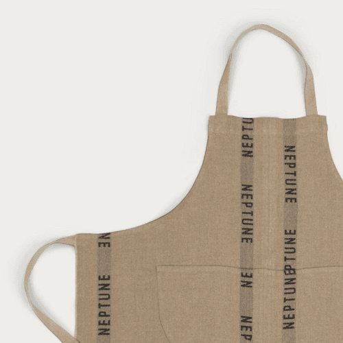 Image showing the Neptune Kitchen Apron, Natural/Black product.