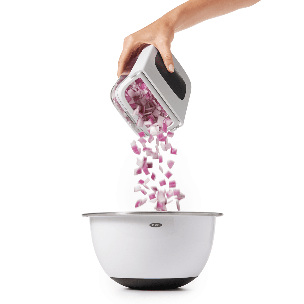 Vegetable chopper with easy pour opening