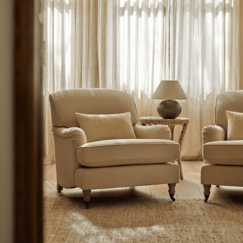 Image showing the Olivia Armchair, Hugo Pale Oat With Pale Oak Legs product.