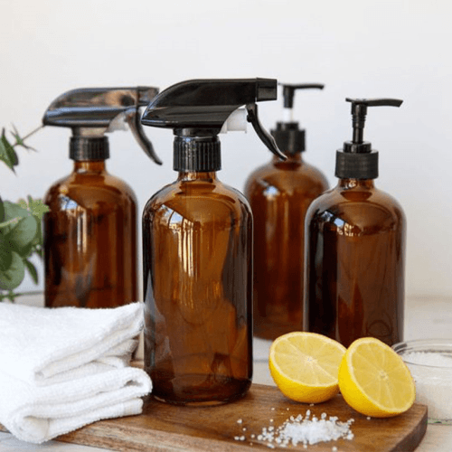 Image showing the Living Nostalgia Amber Glass Reusable Spray and Pump Bottle Set product.