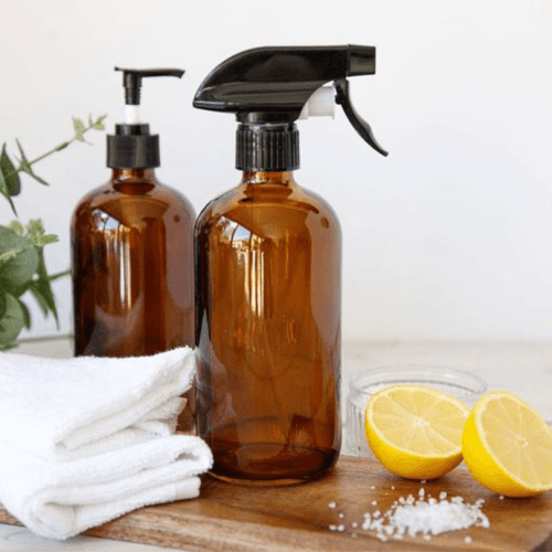 Image showing the Living Nostalgia Amber Glass Reusable Spray and Pump Bottle Set product.