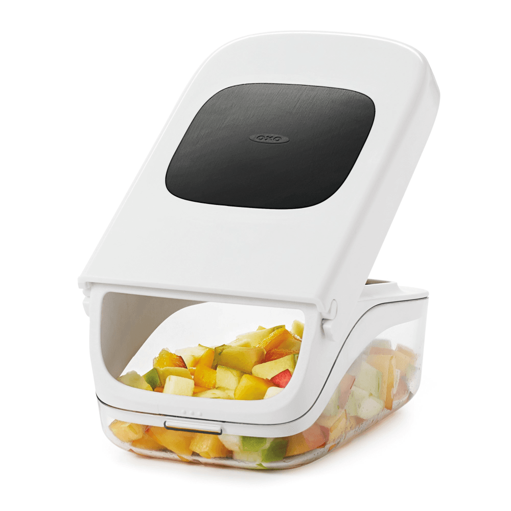 Vegetable chopper with easy pour opening