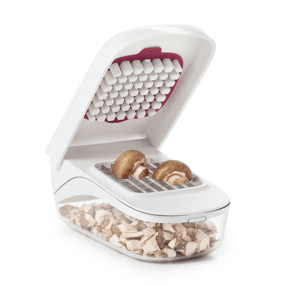 Vegetable chopper with easy pour opening