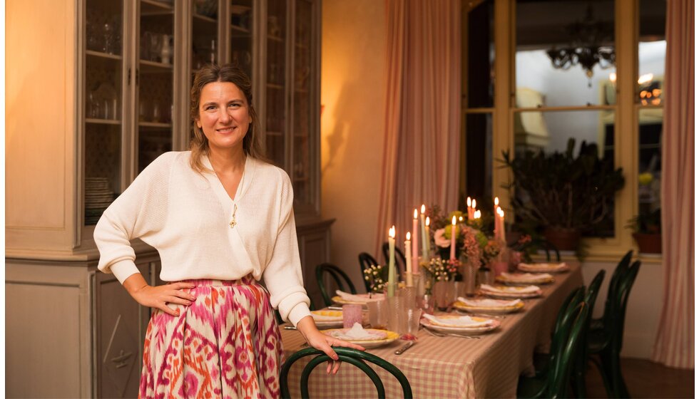 Supper Club with Skye McAlpine | Skye McAlpine at her home, standing next to a beautifully set table at her home