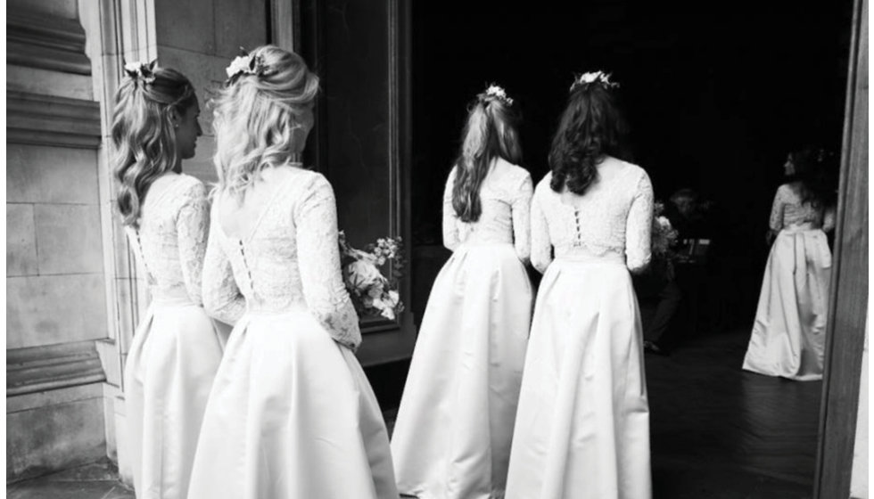 The bridesmaids entering the church.