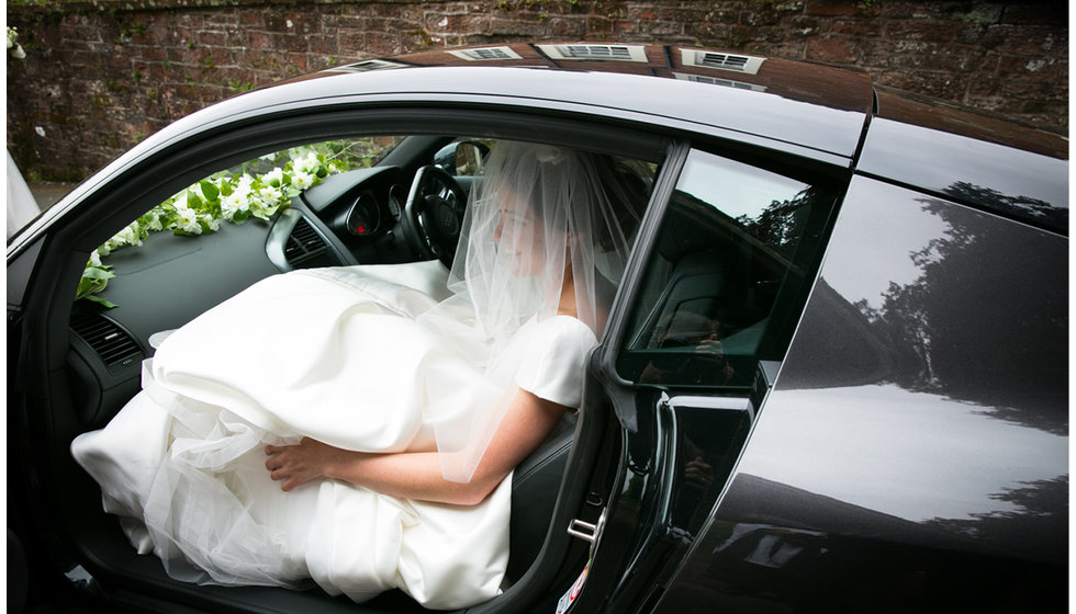 Min getting out of her Dad's Audi R8 on the way to the wedding. 