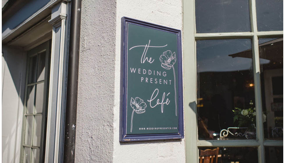 The Wedding Present Cafe sign designed by ERA calligraphy.