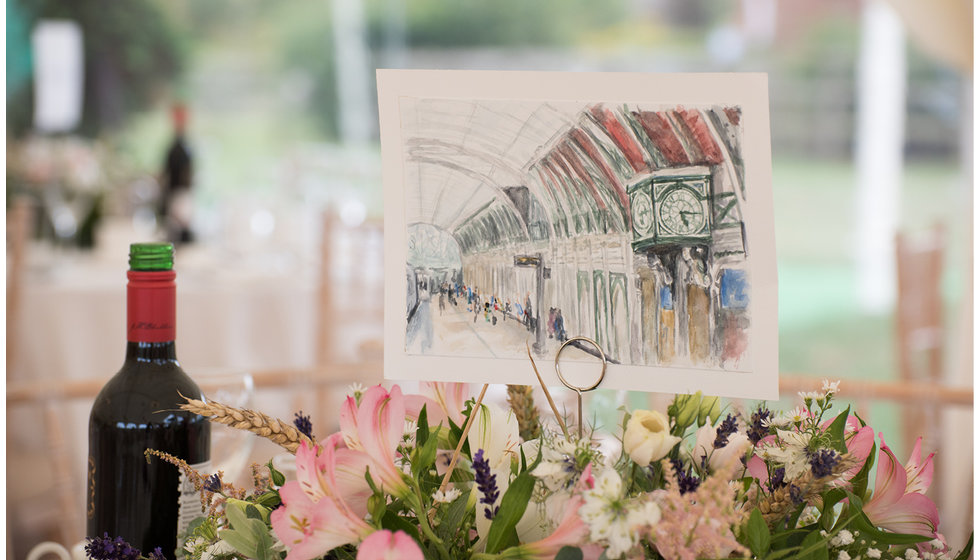 The table names were painted in watercolour by the bride's friend.