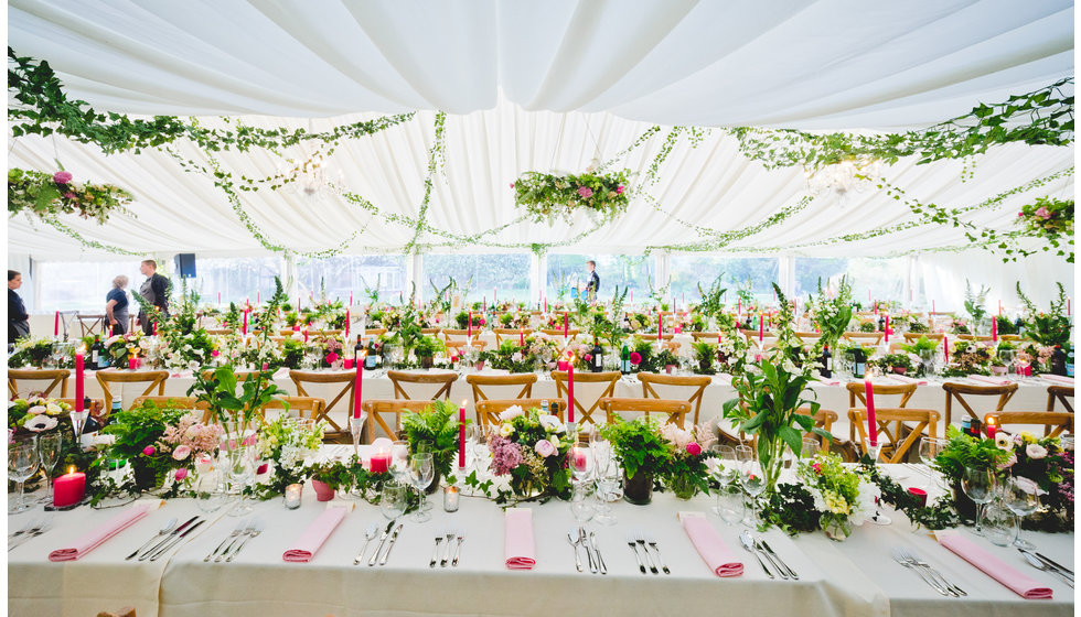 A shot of the marquee with lots of flowers.