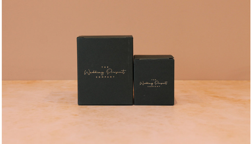 An image of our small and large branded candle packaging.