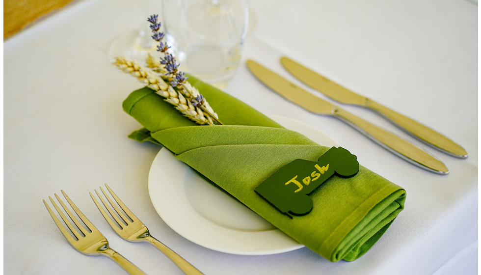 The place setting details showing a sprig of barley and lavender from the field with a landrover placename for each guest.