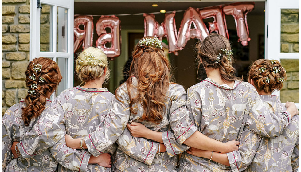 The bridesmaids all in matching pyjamas and had their hair done on the morning of Victoria's wedding.