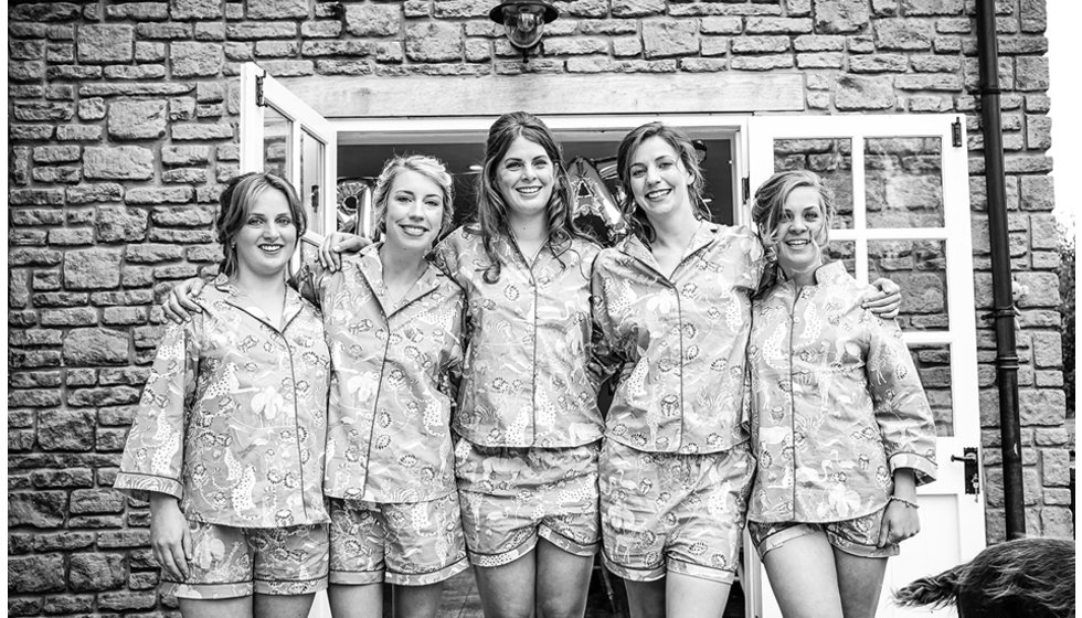 Victoria and her bridesmaids all in matching pyjamas getting ready in the morning.