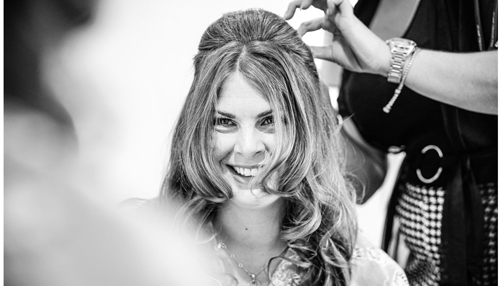 The bride having her hair curled. 