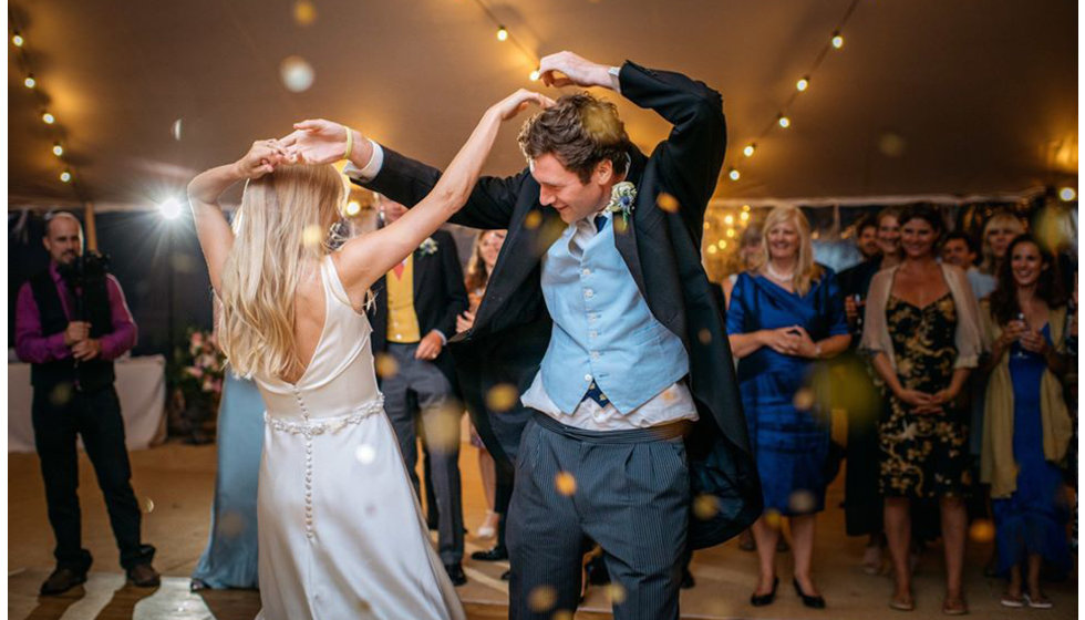 A bride and groom dancing their first dance.