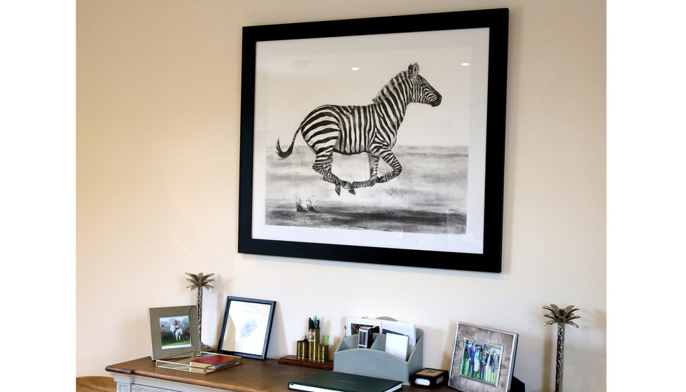 Sophie's house with a painting of a zebra running.