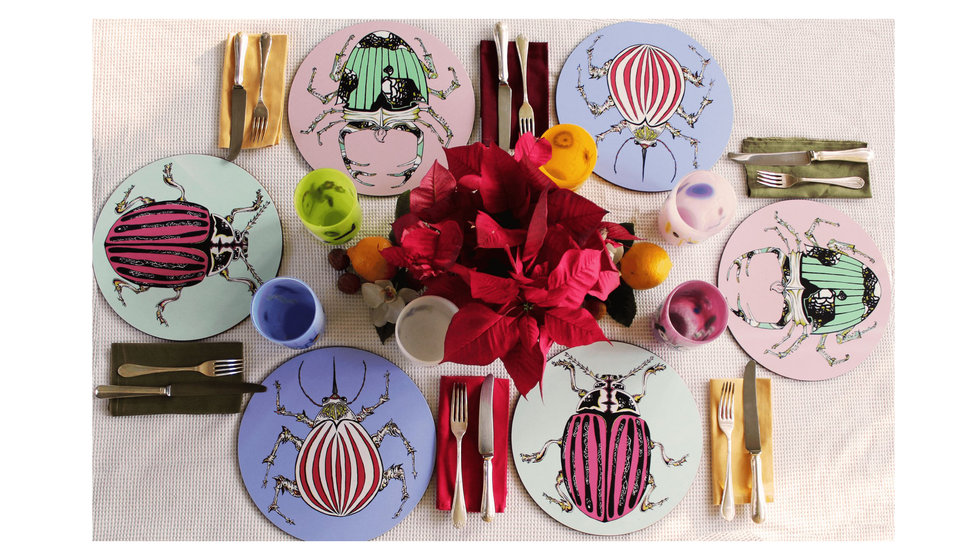 A tablescape with Bells different colour beetle placemats. 