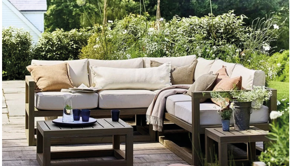 An outdoor sofa and table by WPC brand Neptune.