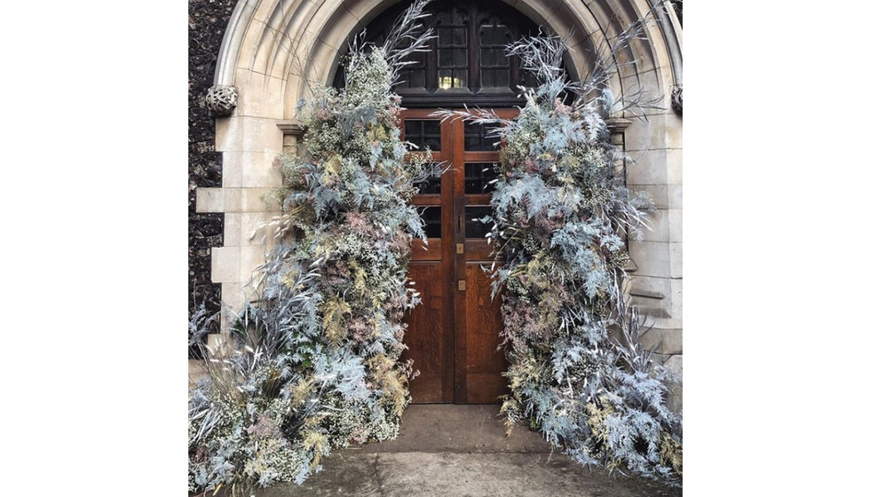 A beautiful winter floral arch outside Church doors. 