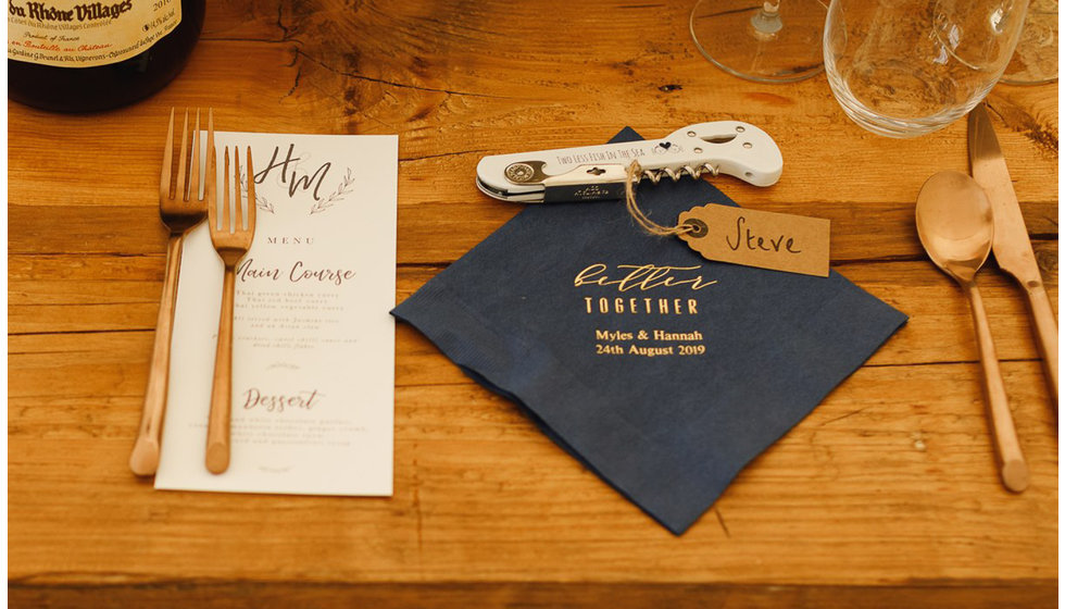 The menu and napkin and a personalised bottle opener.